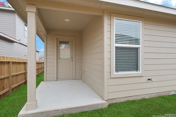 a view of house with backyard