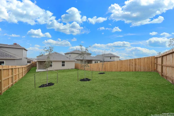 a view of backyard with a garden and entertaining space