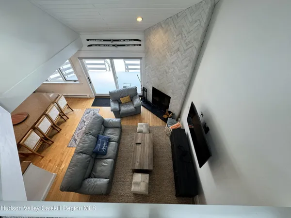 view of living room with furniture and a large window