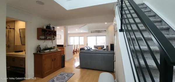 a kitchen with stainless steel appliances granite countertop sink stove and refrigerator
