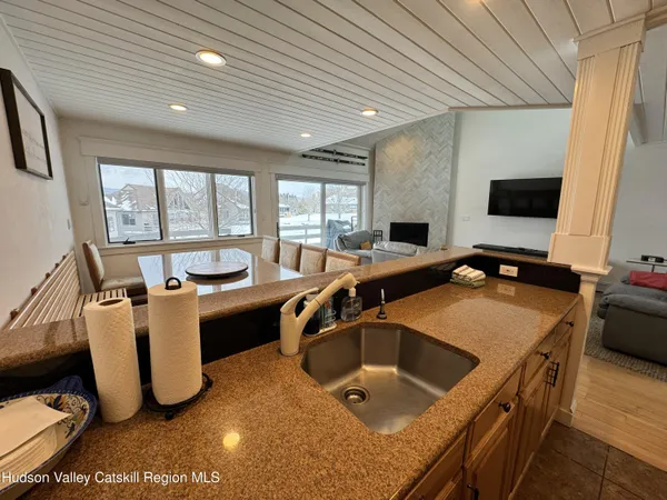 a room with gym equipment and a flat screen tv