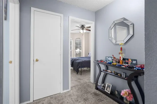 a view of a livingroom with furniture and a mirror
