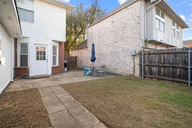 a backyard of a house with seating space