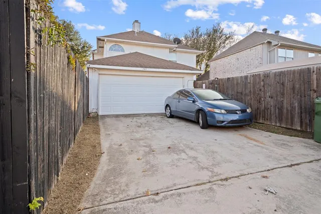 a car parked in front of a house