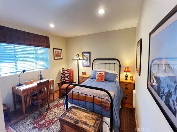 a bedroom with furniture and a window