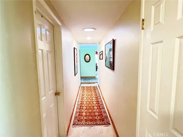 a view of a hallway with windows