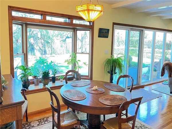 a view of a dining room with furniture window and outside view