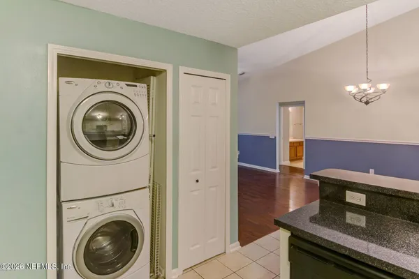 a view of a hallway with washer and dryer