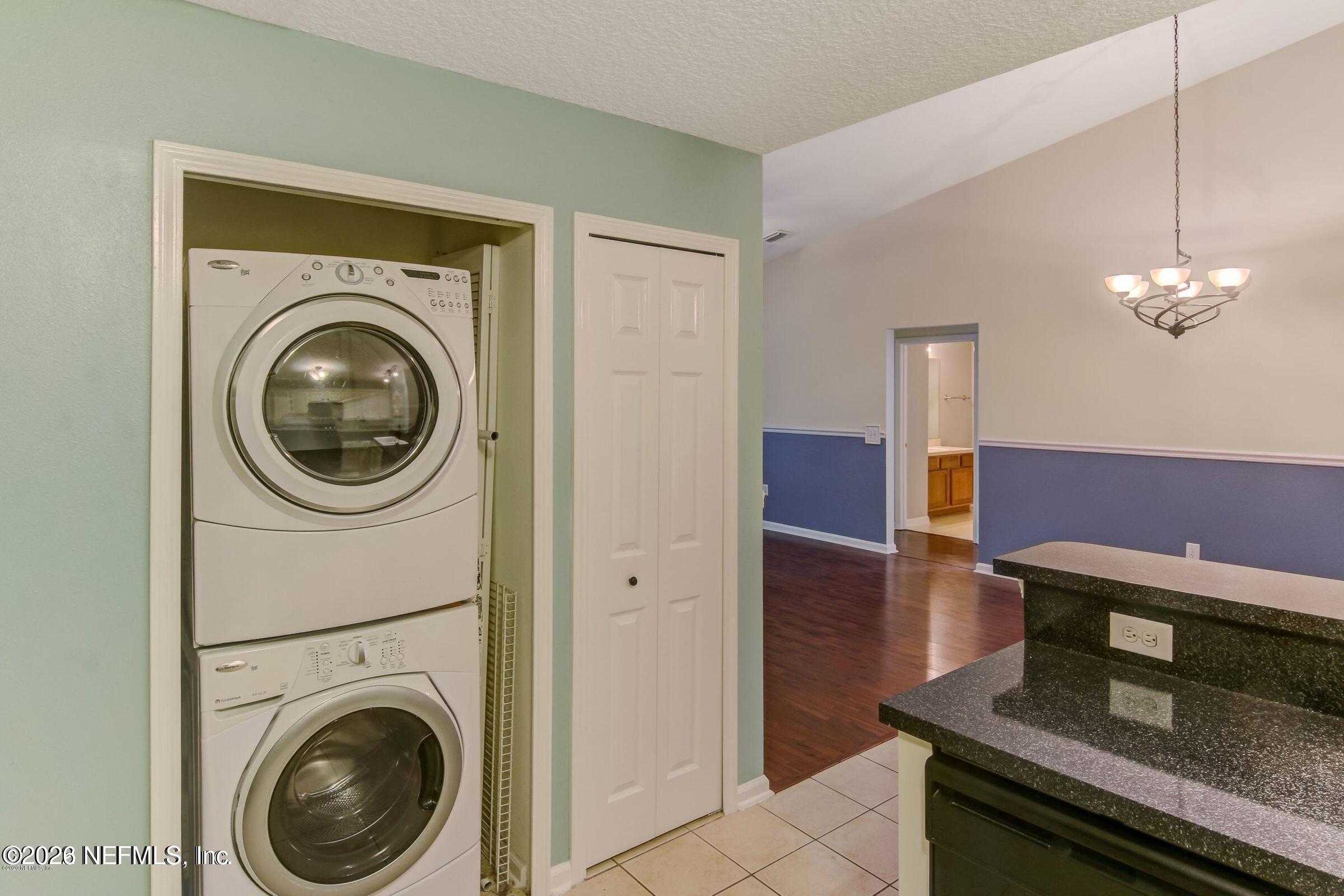6057 Maggies Circle, Unit 110 Jacksonville, FL 32244 - Photo 4 of 9 a view of a hallway with washer and dryer