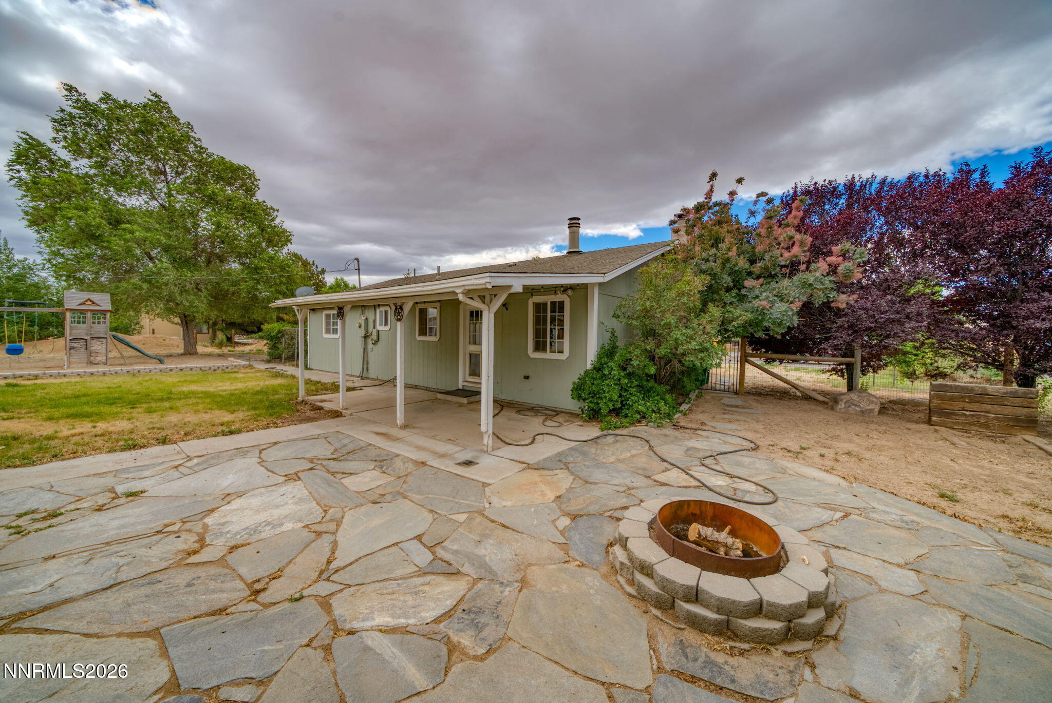 11577 Deodar Way Reno, NV 89506 - Photo 40 of 58 a front view of a house with a yard