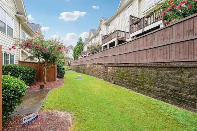 a view of a back yard with a chair
