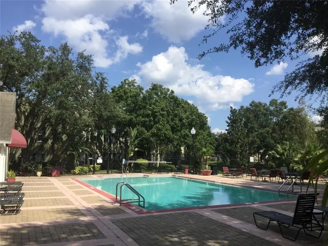 a view of a playground with basketball court