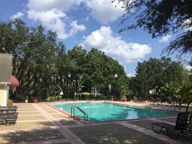 a view of outdoor space with playground and green space