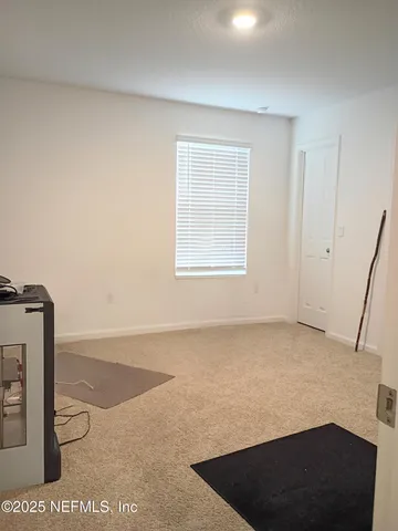 a view of an empty room and window