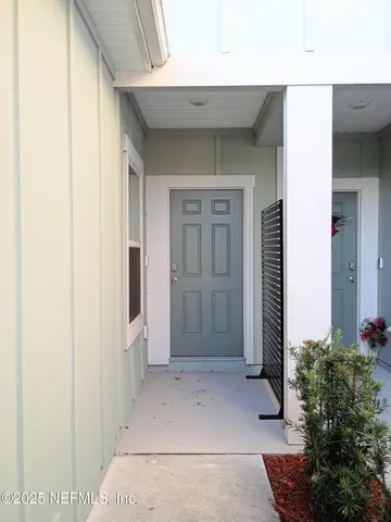 a view of a bathroom with a glass door