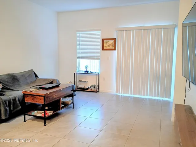 a room with furniture and a window