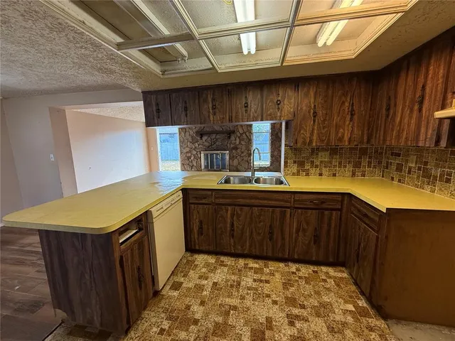 a front view of a house with garage