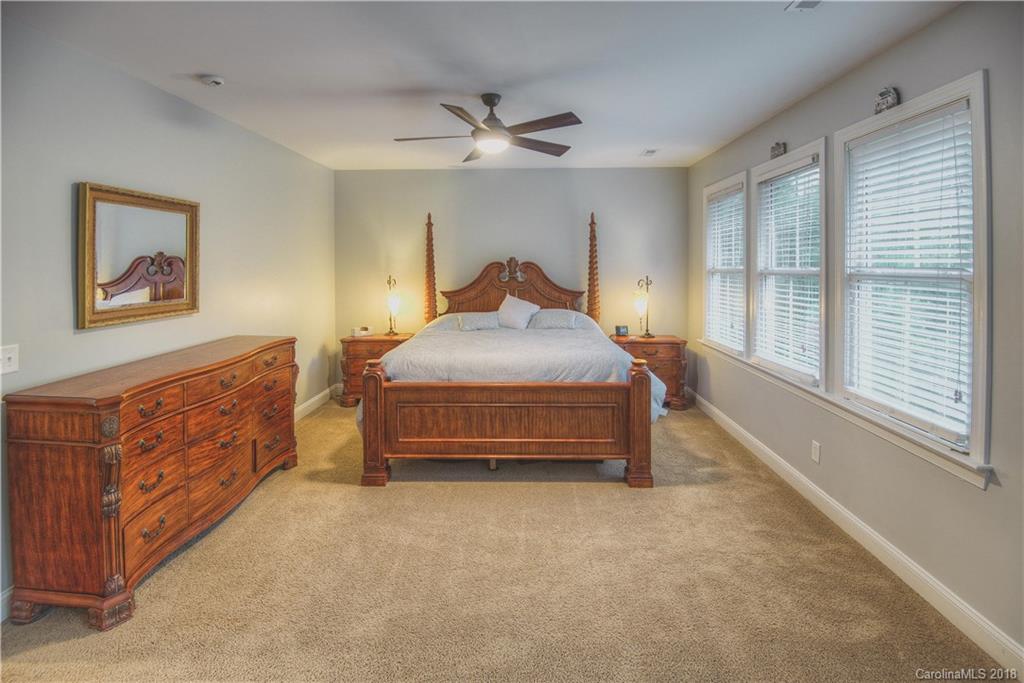 122 Mills Lane Fort Mill, SC 29708 - Photo 12 of 36 a bedroom with a bed dresser and a window