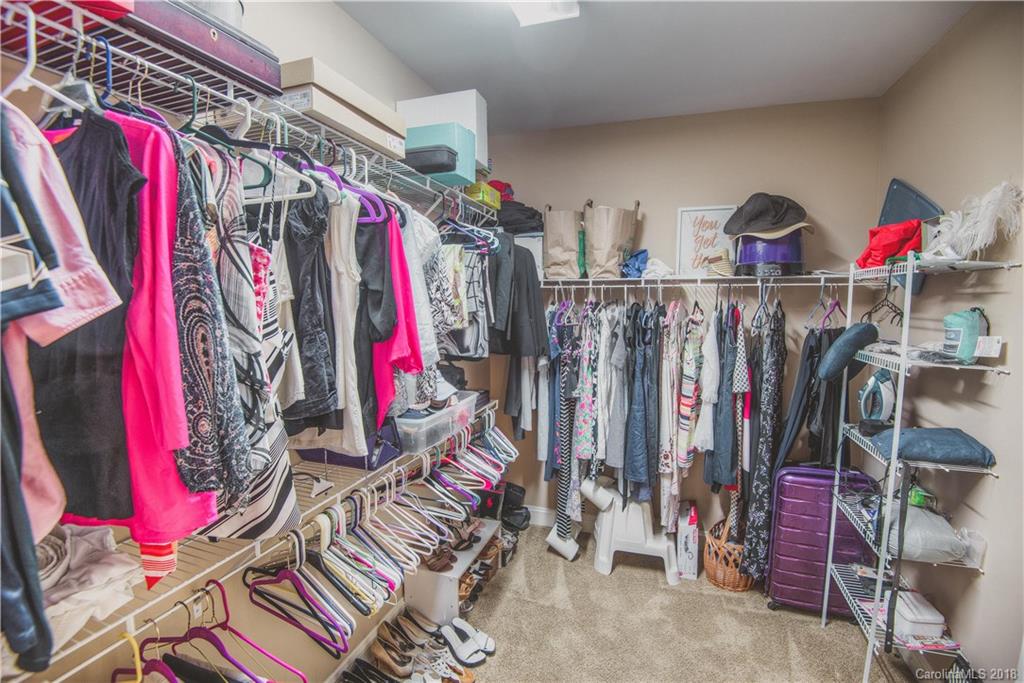 122 Mills Lane Fort Mill, SC 29708 - Photo 16 of 36 a view of walk in closet with clothes