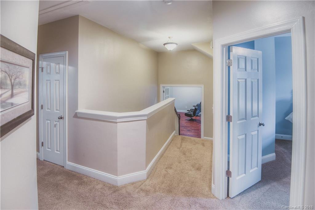 122 Mills Lane Fort Mill, SC 29708 - Photo 18 of 36 a view of a hallway with closet and a bathroom