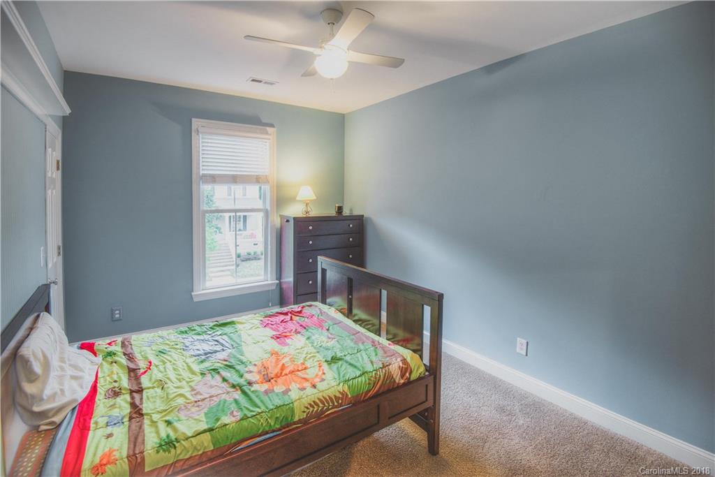 122 Mills Lane Fort Mill, SC 29708 - Photo 21 of 36 a bedroom with bed and a window
