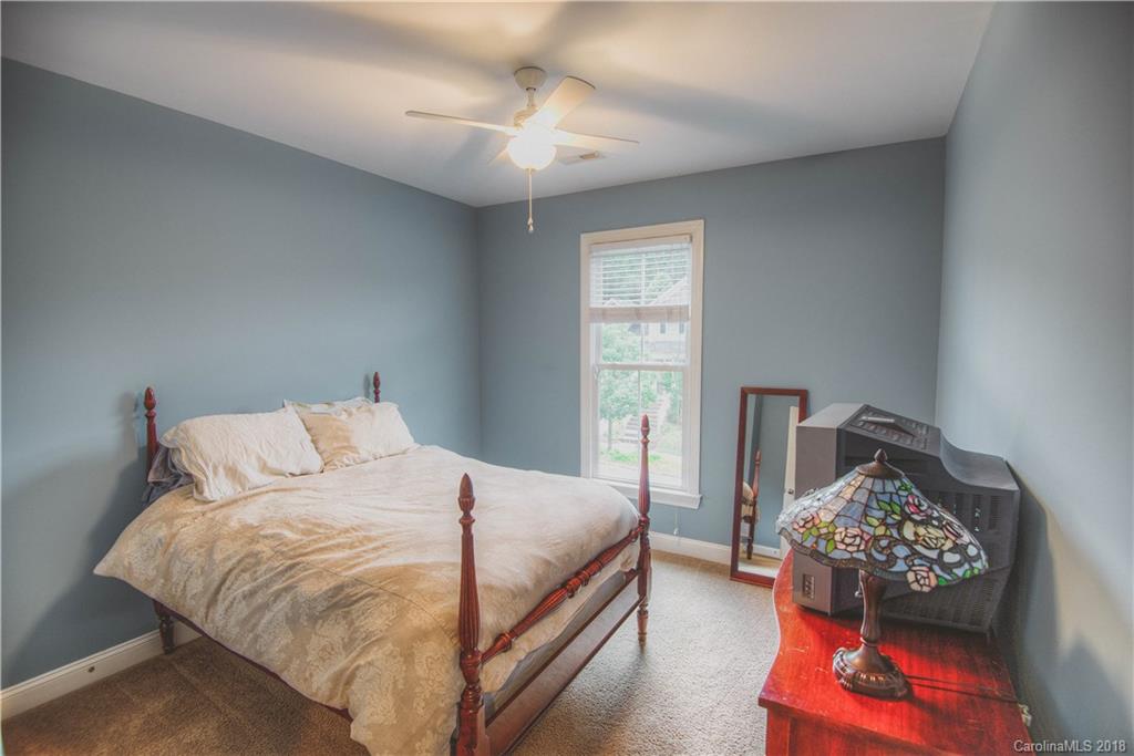 122 Mills Lane Fort Mill, SC 29708 - Photo 22 of 36 a bedroom with bed and window