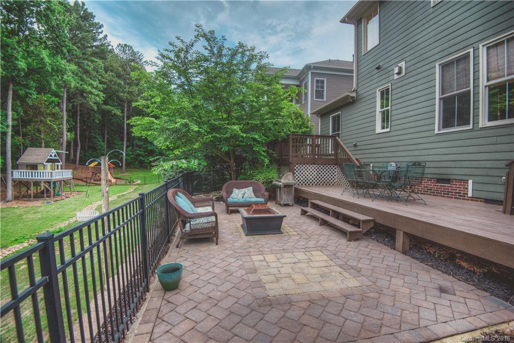 122 Mills Lane Fort Mill, SC 29708 - Photo 29 of 36 a view of a patio with chairs and a table