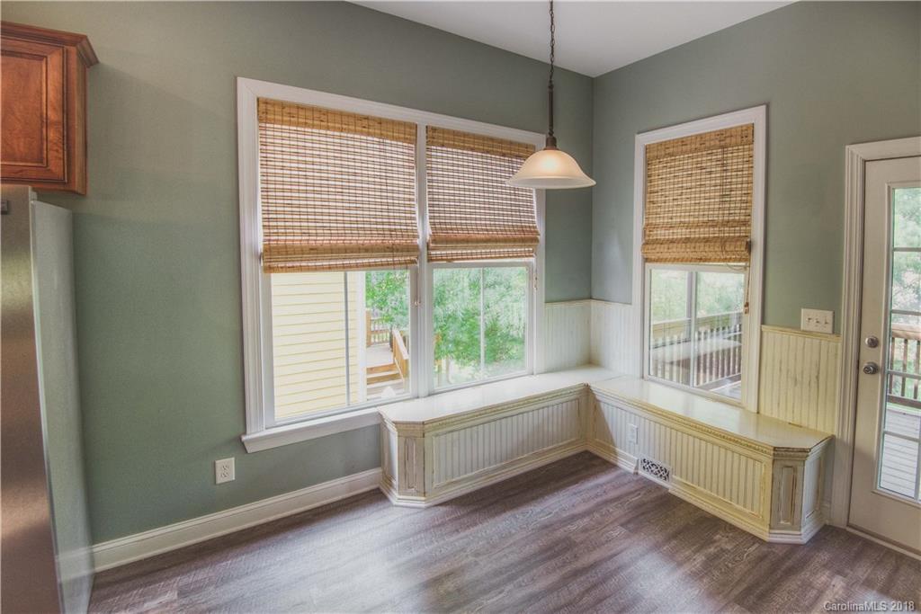 122 Mills Lane Fort Mill, SC 29708 - Photo 10 of 36 a room with window and wooden floor