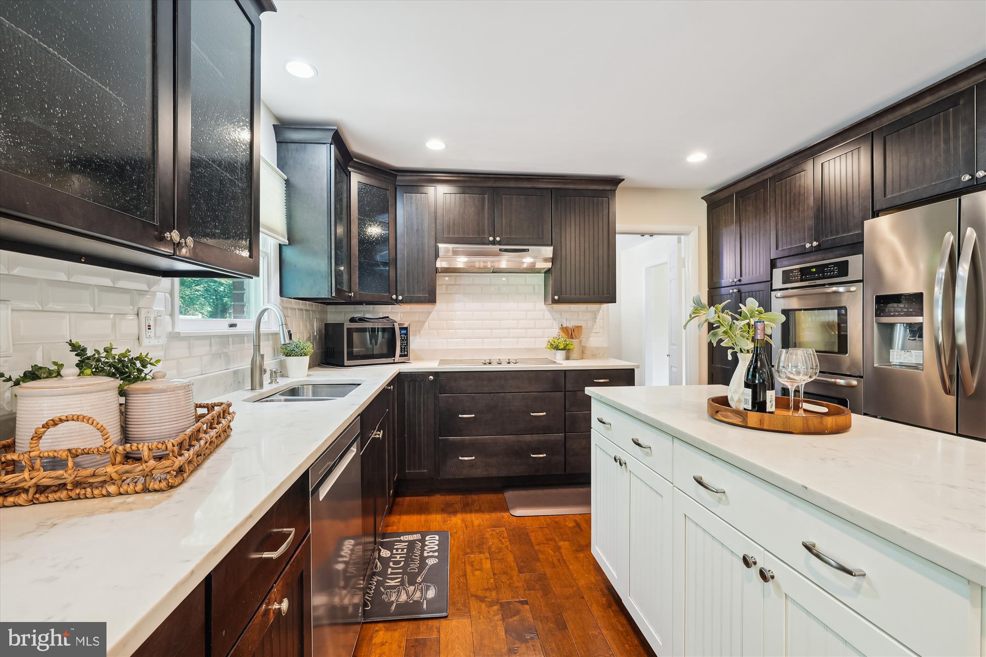 17721 Lisa Drive Derwood, MD 20855 - Photo 21 of 87 a kitchen with kitchen island granite countertop stainless steel appliances and sink