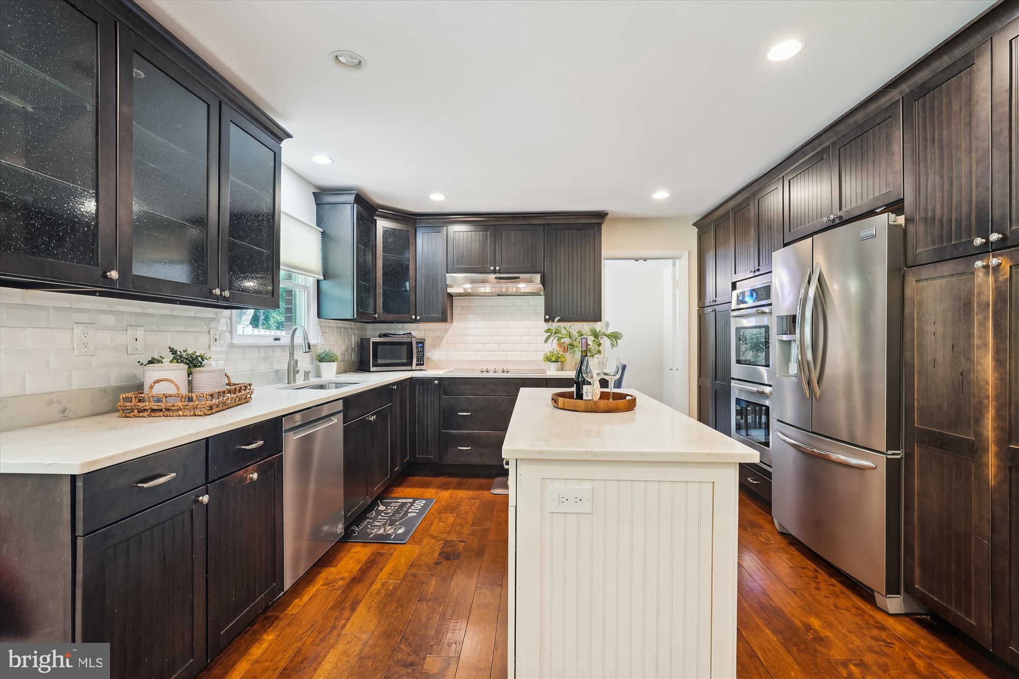 17721 Lisa Drive Derwood, MD 20855 - Photo 23 of 87 a kitchen with stainless steel appliances sink stove refrigerator and cabinets