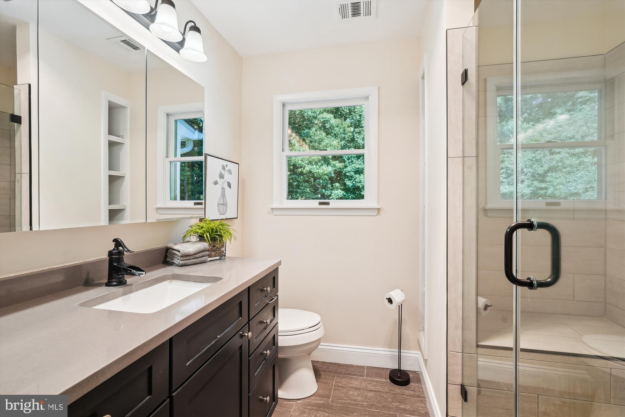 17721 Lisa Drive Derwood, MD 20855 - Photo 38 of 87 a bathroom with a granite countertop toilet sink and mirror