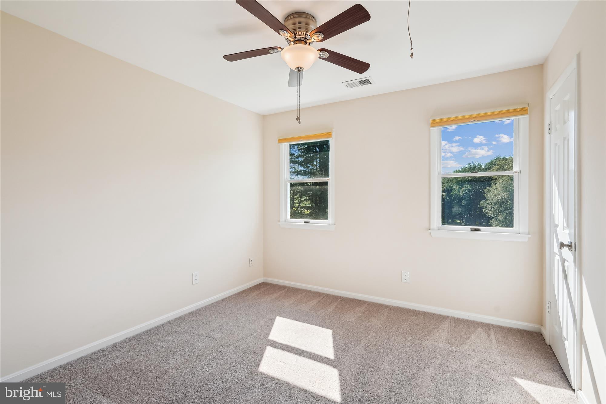 17721 Lisa Drive Derwood, MD 20855 - Photo 42 of 87 an empty room with a window and a ceiling fan