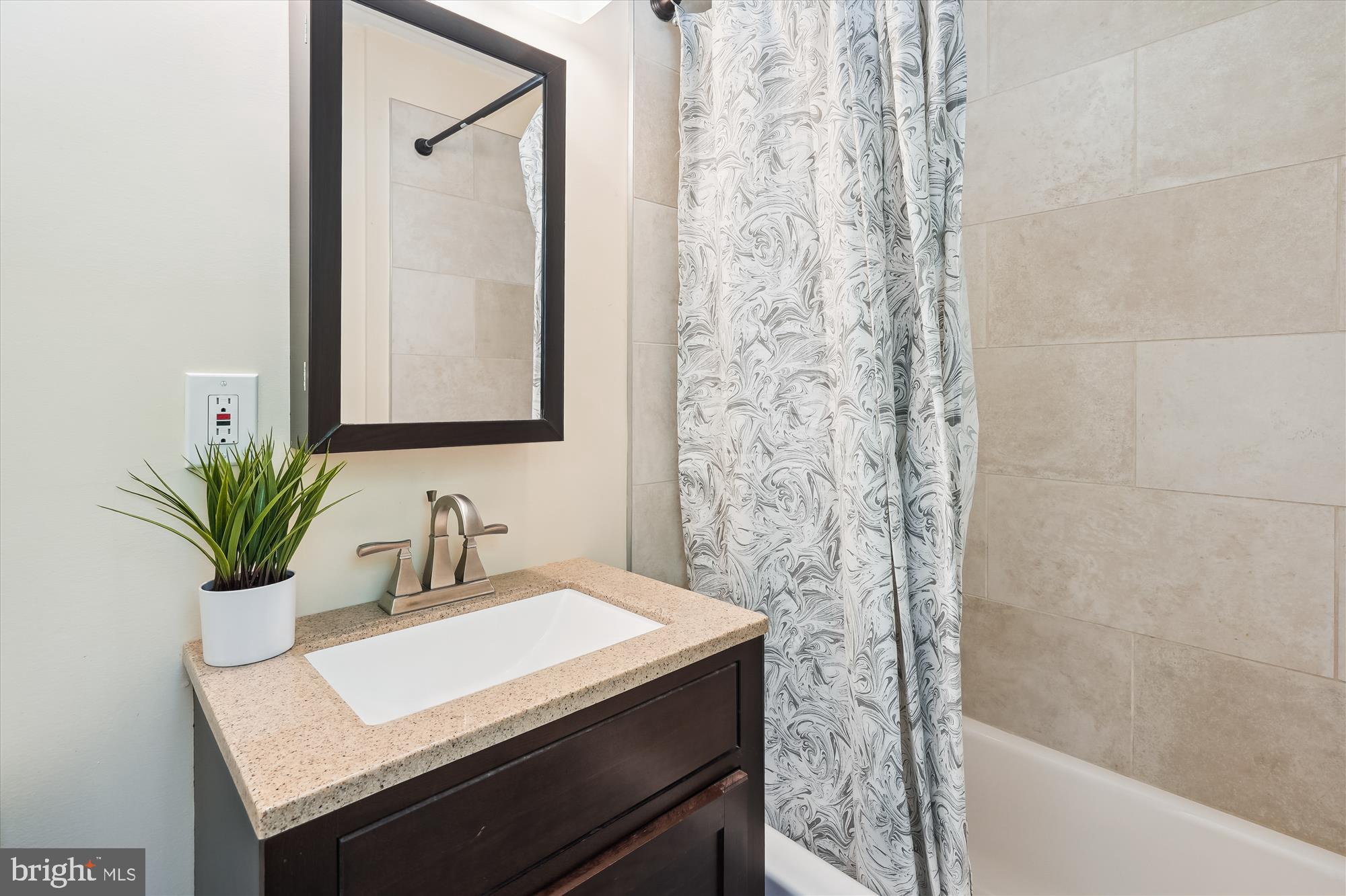 17721 Lisa Drive Derwood, MD 20855 - Photo 50 of 87 a bathroom with a sink a mirror and a shower