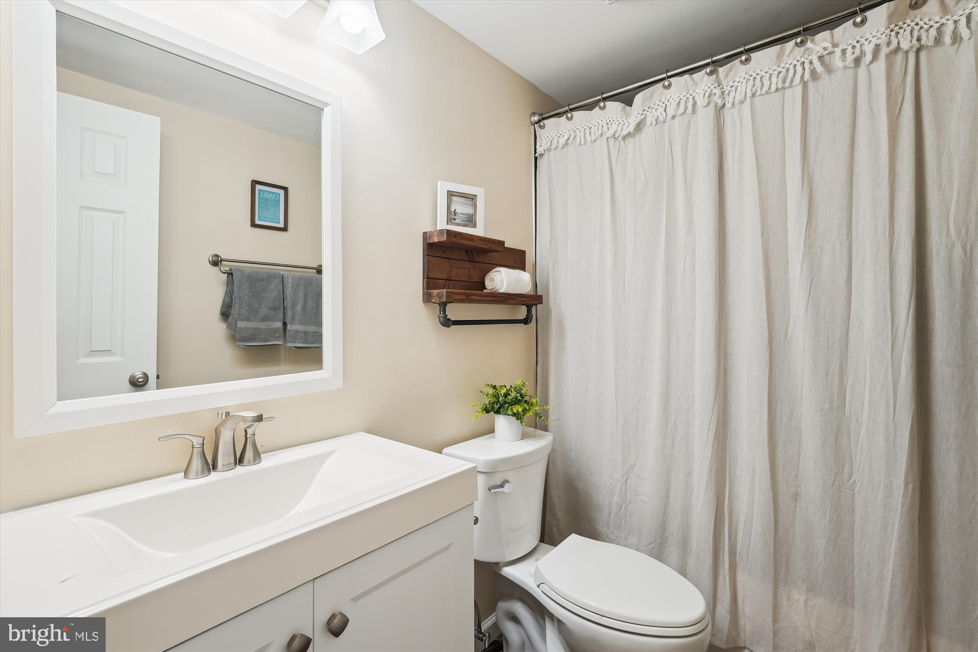 17721 Lisa Drive Derwood, MD 20855 - Photo 58 of 87 a bathroom with a sink vanity mirror and toilet