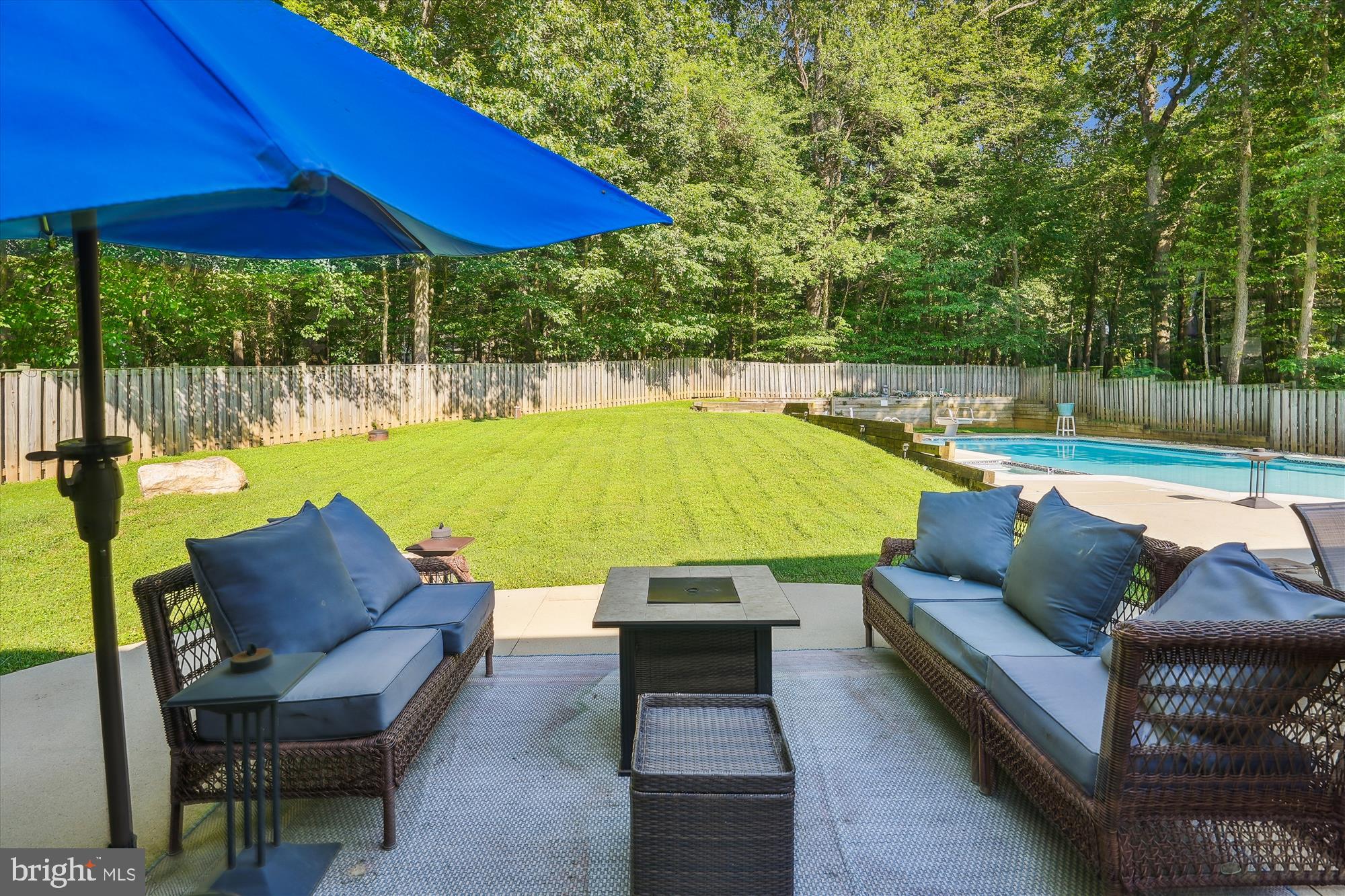 17721 Lisa Drive Derwood, MD 20855 - Photo 64 of 87 a view of a swimming pool with a couches in a patio