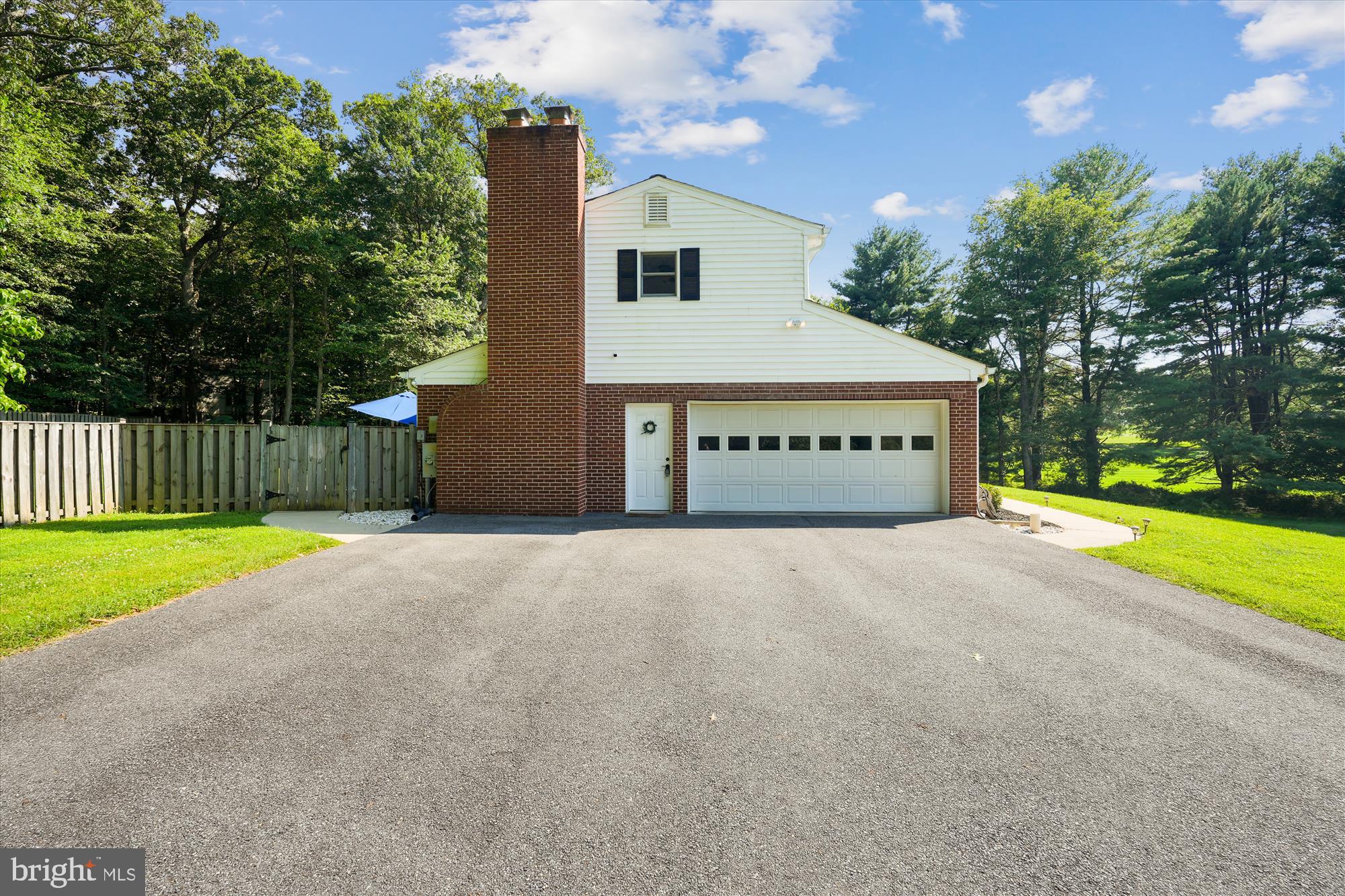 17721 Lisa Drive Derwood, MD 20855 - Photo 7 of 87 a view of a house with a yard and garage