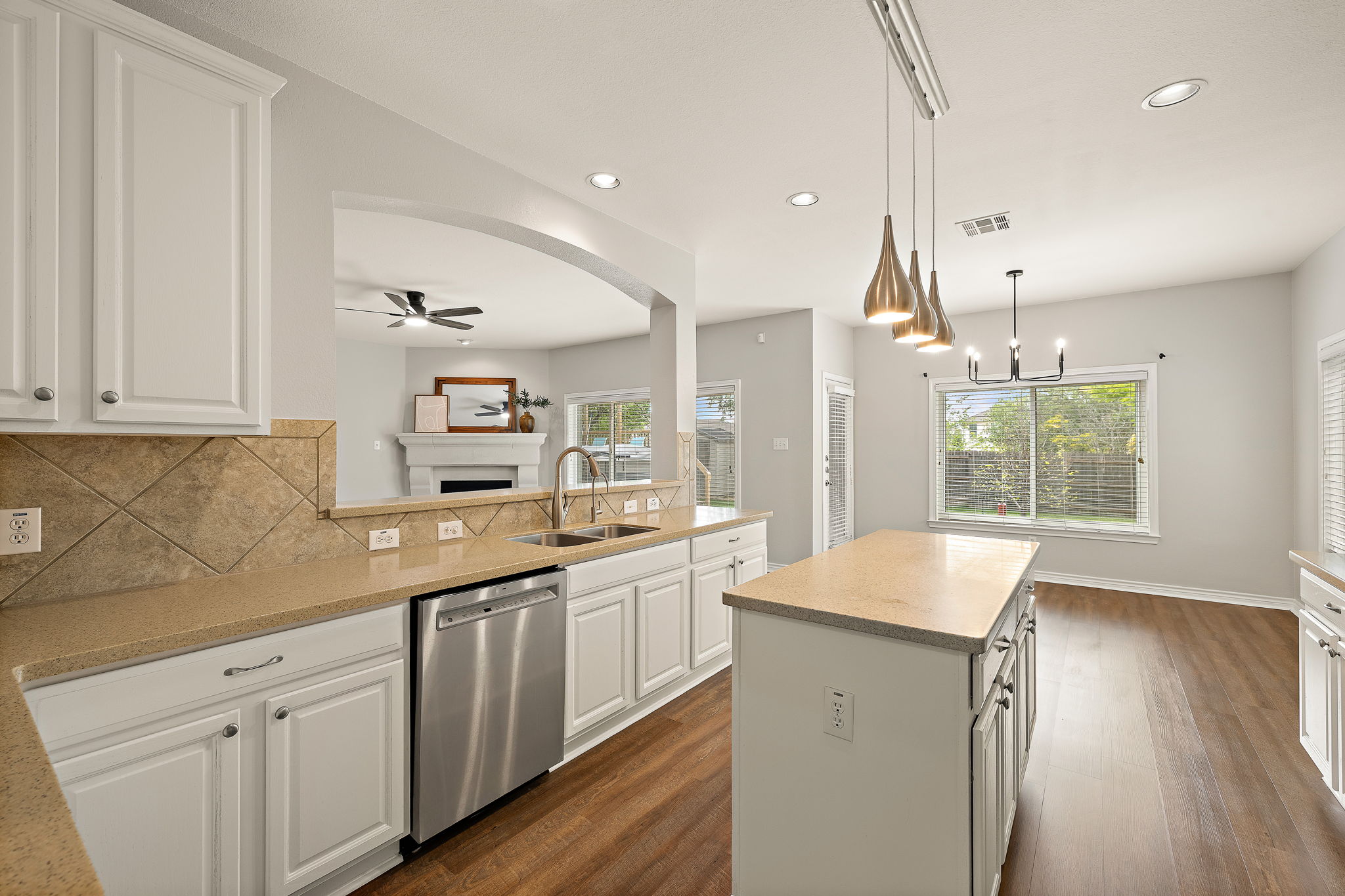 202 Nick Price Loop Round Rock, TX 78664 - Photo 14 of 39 a kitchen with a sink window and cabinets