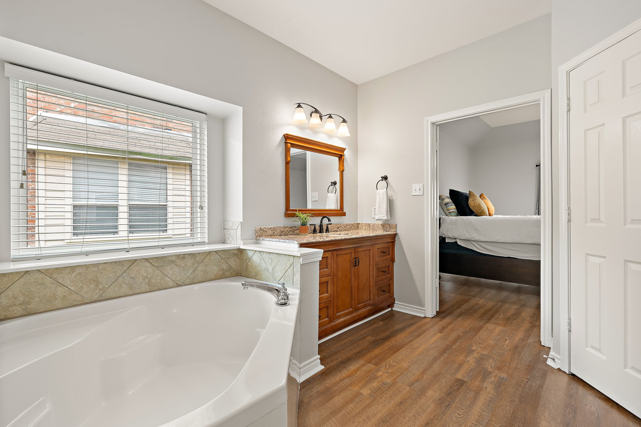 202 Nick Price Loop Round Rock, TX 78664 - Photo 19 of 39 a bathroom with a tub sink and mirror