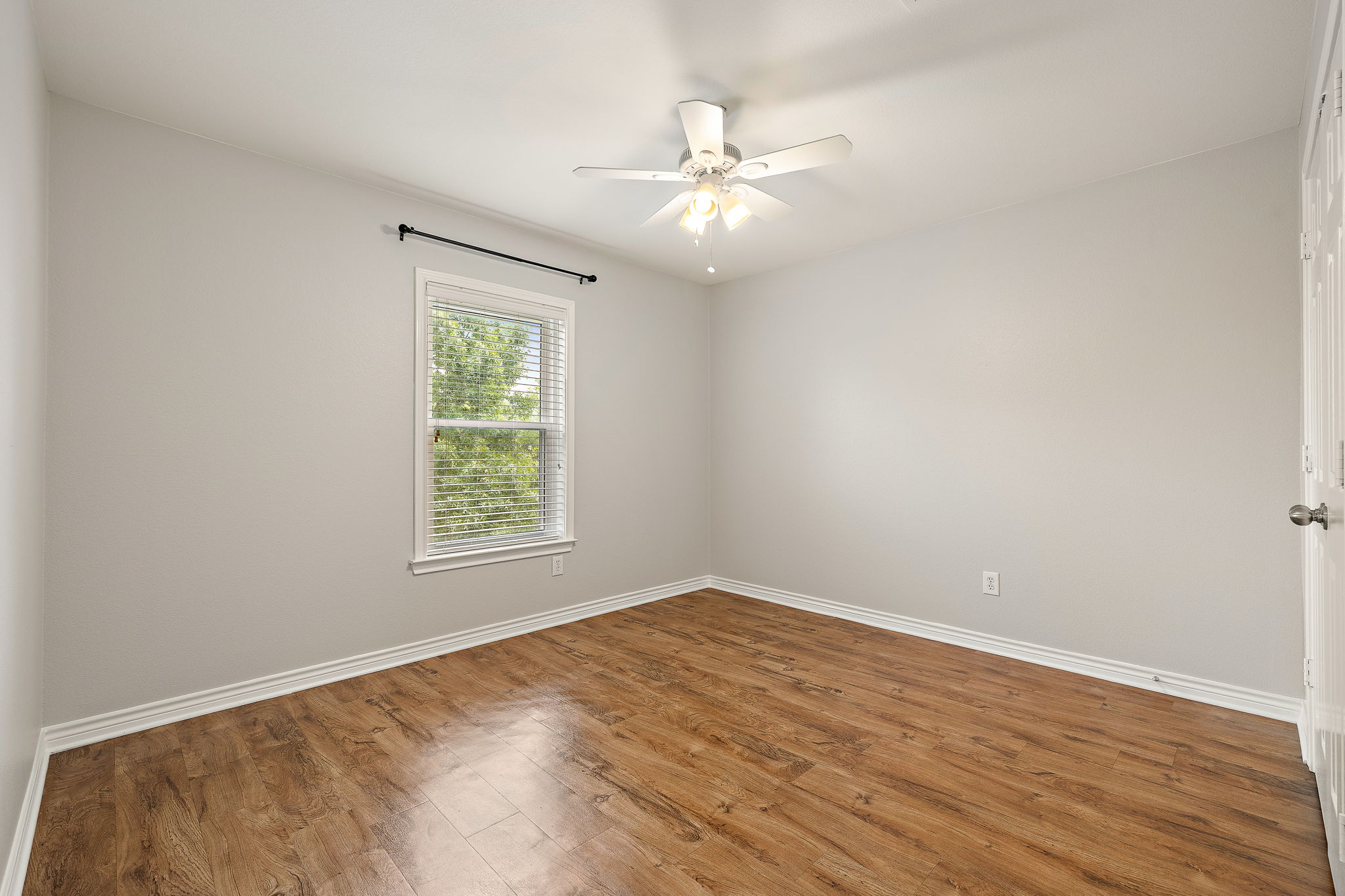 202 Nick Price Loop Round Rock, TX 78664 - Photo 26 of 39 a view of an empty room with wooden floor and a window