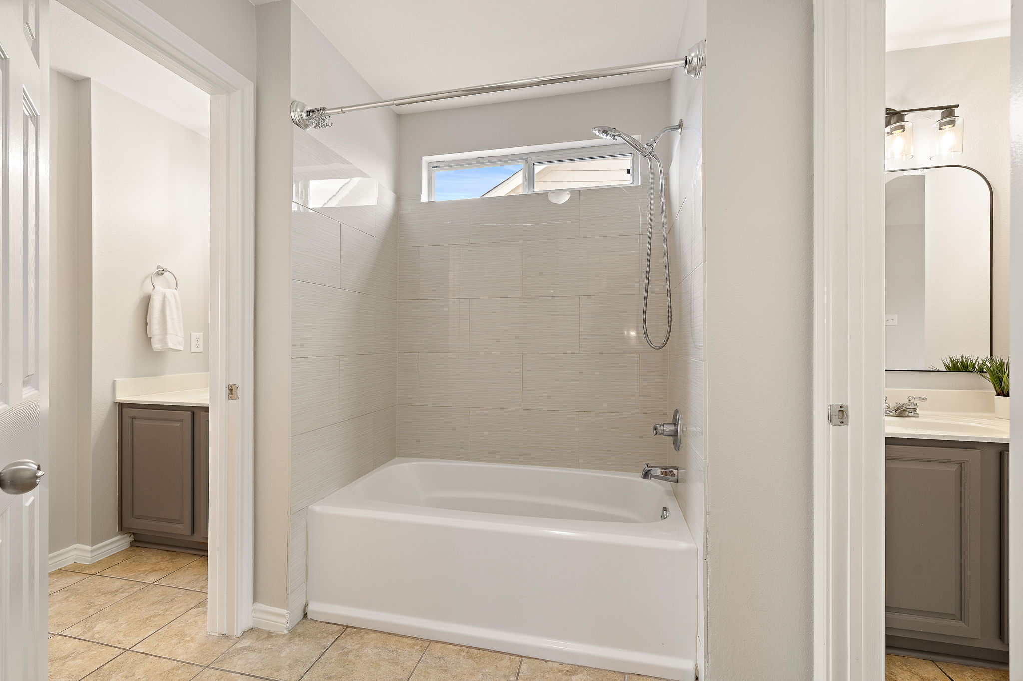 202 Nick Price Loop Round Rock, TX 78664 - Photo 29 of 39 a bathroom with a bathtub and a shower