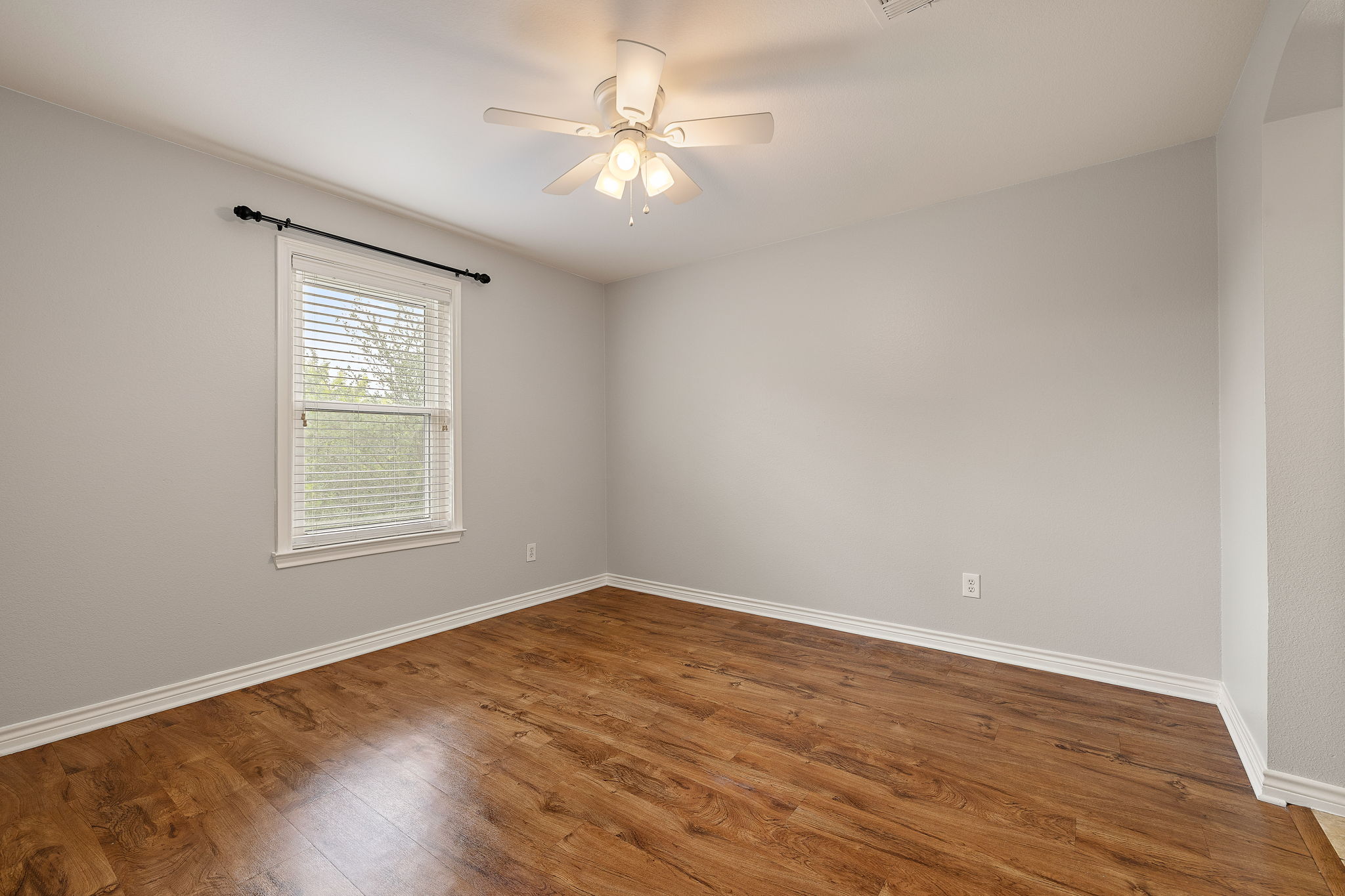 202 Nick Price Loop Round Rock, TX 78664 - Photo 32 of 39 wooden floor in an empty room with a window