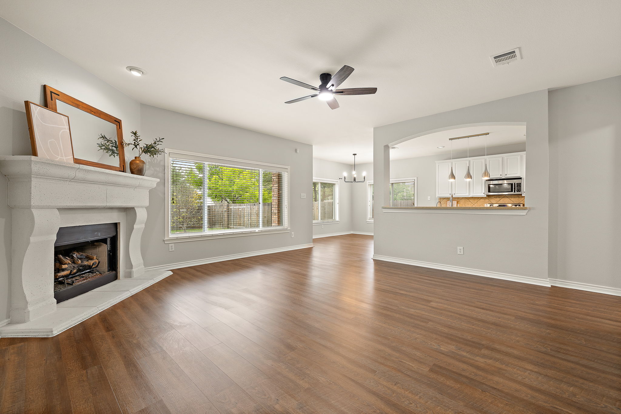 202 Nick Price Loop Round Rock, TX 78664 - Photo 7 of 39 a view of empty room with wooden floor and fan