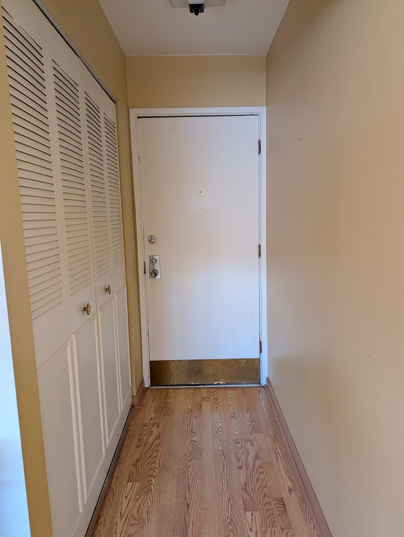8444 West Wilson Avenue, Unit 407 Chicago, IL 60656 - Photo 15 of 20 a view of room with hardwood floor