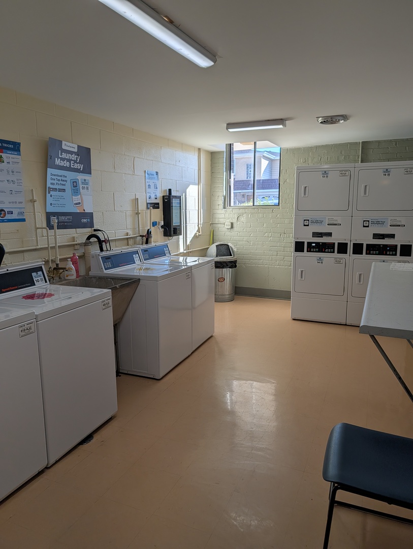 8444 West Wilson Avenue, Unit 407 Chicago, IL 60656 - Photo 16 of 20 a kitchen with a sink cabinets and window
