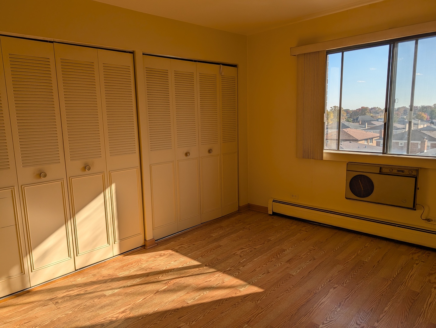 8444 West Wilson Avenue, Unit 407 Chicago, IL 60656 - Photo 8 of 20 a view of an empty room with a window