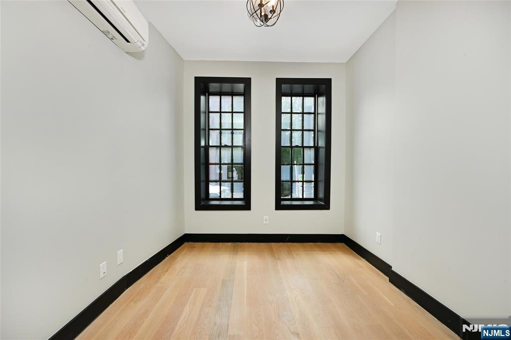 208 15th Street Jersey City, NJ 07310 - Photo 12 of 46 an empty room with windows