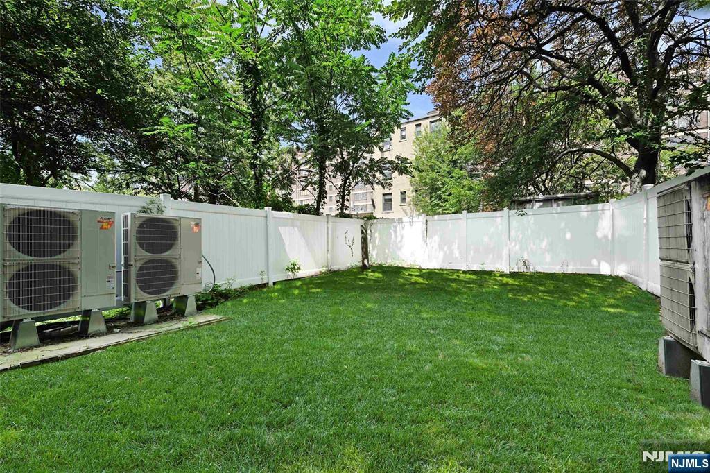 208 15th Street Jersey City, NJ 07310 - Photo 19 of 46 a view of an outdoor space and a yard