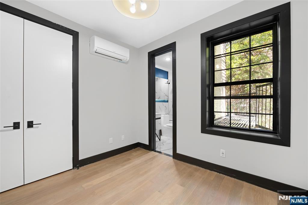 208 15th Street Jersey City, NJ 07310 - Photo 38 of 46 an empty room with windows and closet