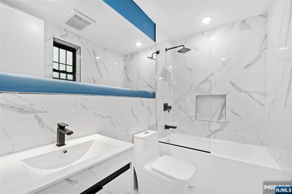 208 15th Street Jersey City, NJ 07310 - Photo 40 of 46 a bathroom with a sink toilet and shower