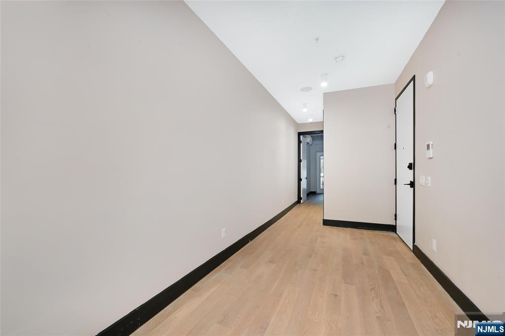 208 15th Street Jersey City, NJ 07310 - Photo 4 of 46 a view of hallway with a large window